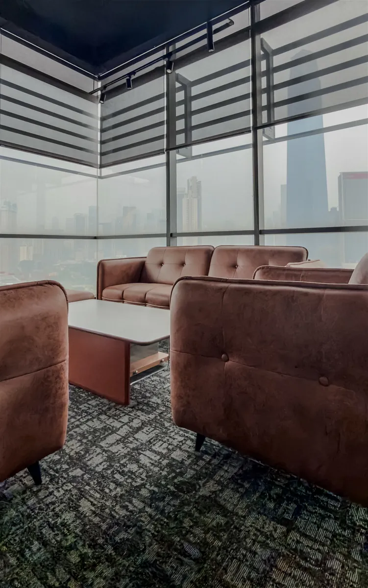 The client lounge, with the Kuala Lumpur skyline through the windows